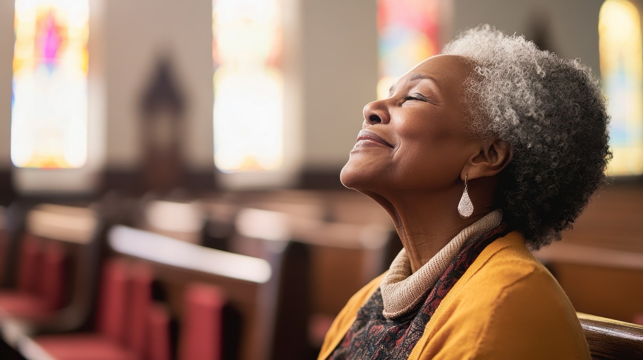 Elderly person worshipping joyfully in church 